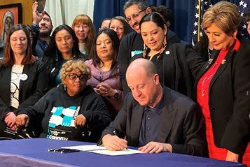 Governor Polis signs for cause renewal law